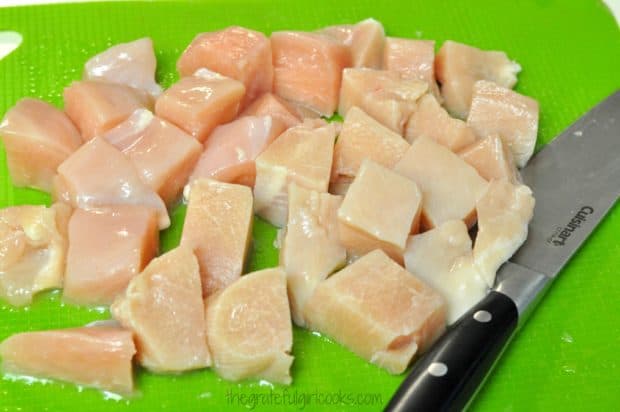 Chicken breasts are cut into chunks for honey lime chicken skewers.