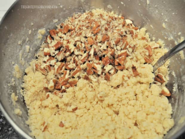 Chopped walnuts are stirred into the dough.