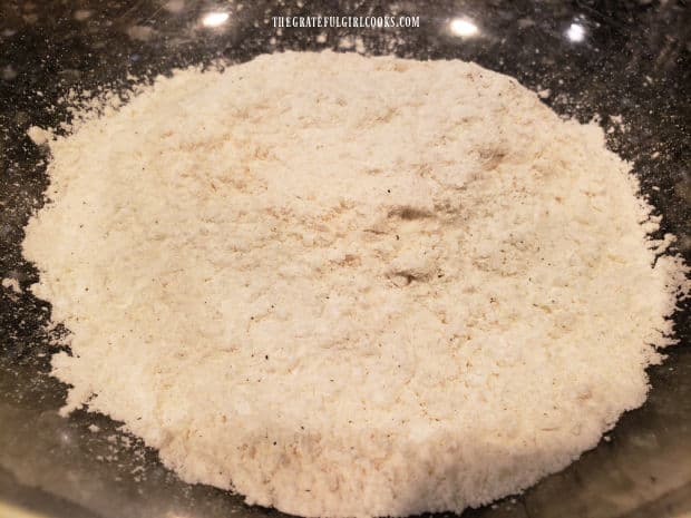 Flour, cornstarch, salt and pepper are combined in a large bowl.