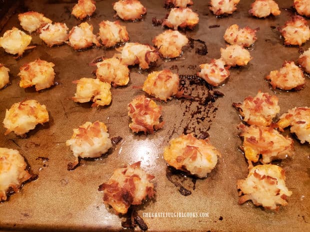 Shrimp on a large baking sheet are kept warm while remaining shrimp cook.