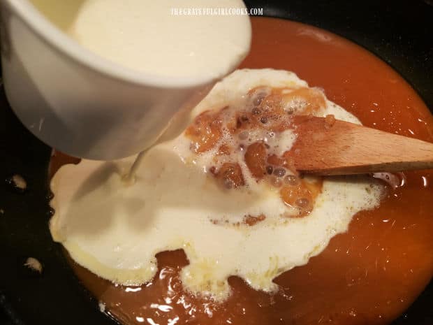 Whipping cream (or half and half) is stirred into the hot caramel sauce.