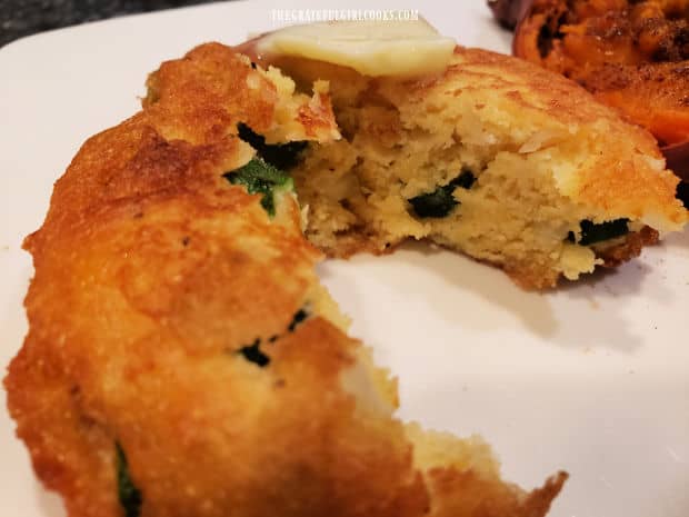 The inside of the cooked fritter reveals the sliced okra inside.