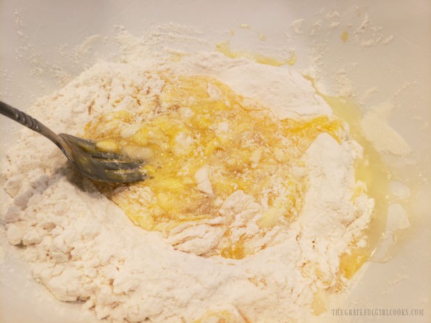 Gradually combining the eggs and the flour and salt mixture until fully blended.