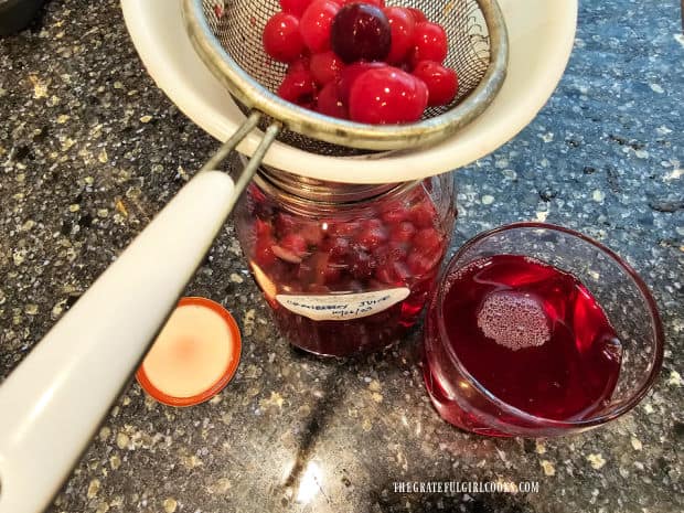 Cranberries are strained from the juice before serving.