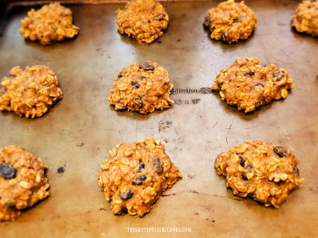 After baking, the cookies cool slightly on the baking sheet.