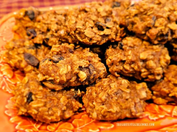 An orange platter of pumpkin spice oatmeal cookies, ready to be eaten.