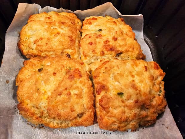 After baking, air fryer cheddar biscuits are golden brown on the outside.