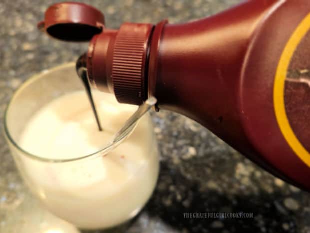 Making chocolate milk using the easy homemade chocolate syrup.