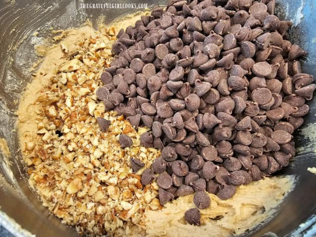 Chocolate chips and chopped pecans are stirred into the cookie dough.