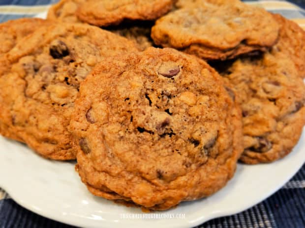 A plate full of jumbo chocolate chip cookies, ready to be enjoyed.