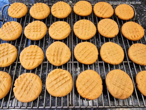 The classic peanut butter cookies cool on a wire rack after baking.
