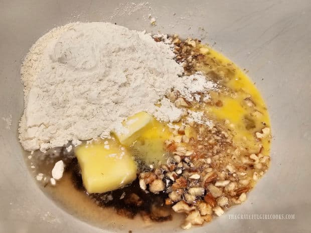 Flour, butter, egg, nuts, baking soda and salt are added to the date mixture.