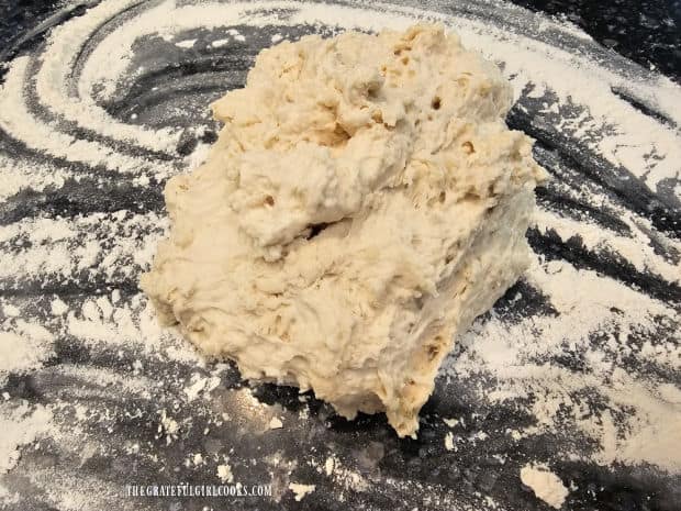 Dough is turned out onto a floured surface to knead it.