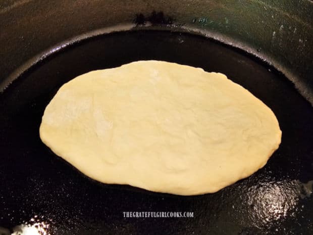 Garlic Butter Naan Bread is cooked one at a time in a very hot, oiled skillet.