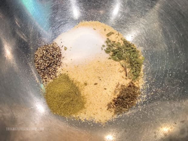 Dry spices are combined in bowl for the chicken marinade.