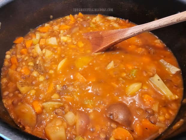 A pot of lentil potato soup is ready to serve, after cooking for 35 minutes.