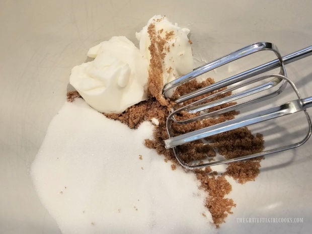 Granulated sugar, vegetable shortening and brown sugar are beaten in bowl.