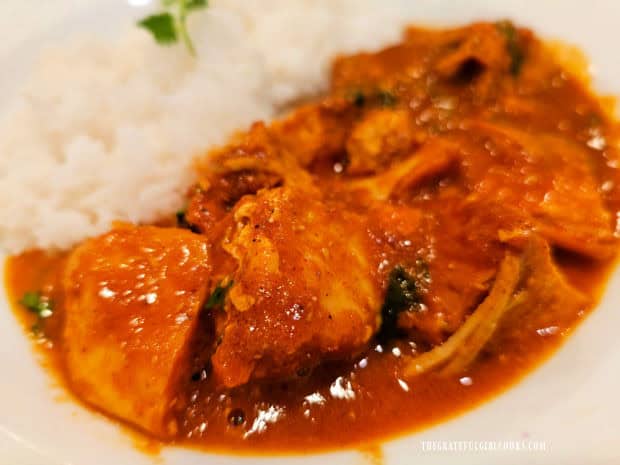 Cubes of chicken are coated in the flavorful butter sauce.