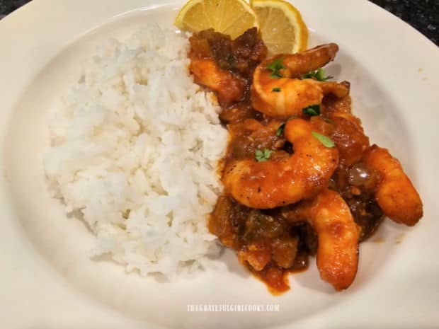 Creole Shrimp and Rice, garnished with parsley, and served with lemon wedges.