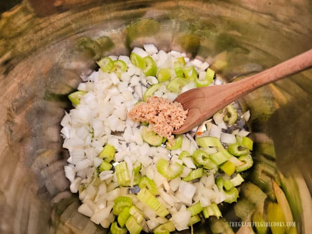 Chopped onions, celery and minced garlic are sautéed in the Instant Pot.