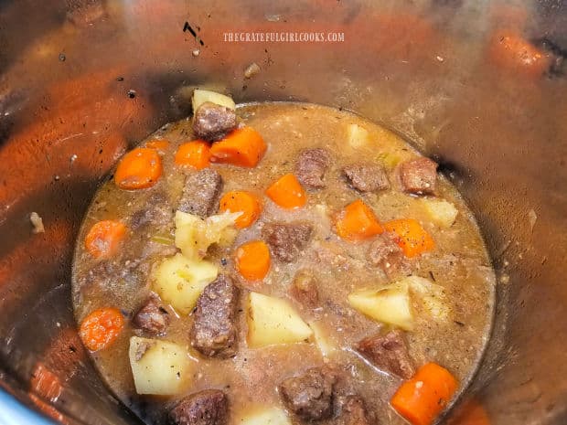 After slurry has been added, the beef stew is ready to be served.