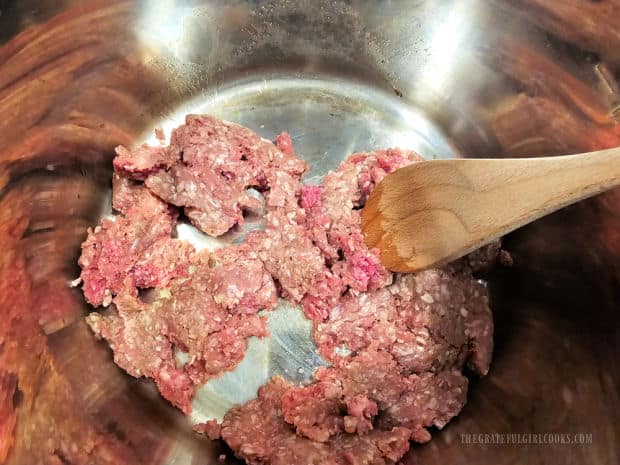 Ground beef is cooked and browned in the Instant Pot.