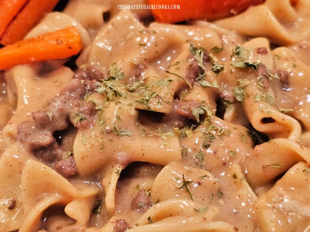 Some dried parsley is sprinkled on the Instant Pot Ground Beef Stroganoff.