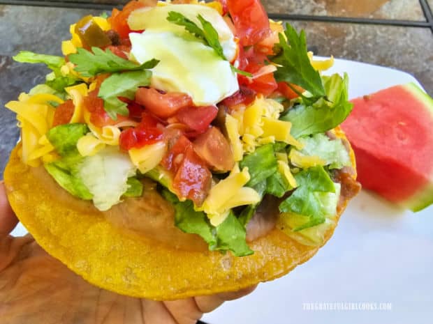 One of the refried bean tostadas, ready to be eaten and enjoyed!