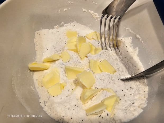 Cold pieces of butter are cut into the dry ingredients using a pastry blender.