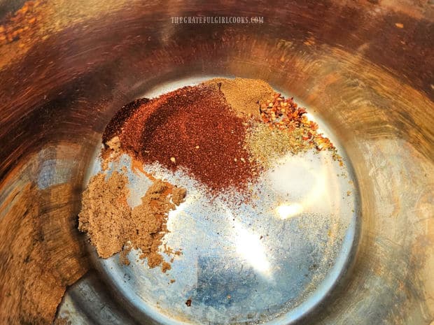 Place spices (chili powder, cumin, etc.) in the Instant Pot's inner pot.