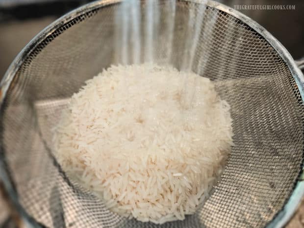 The rice is rinsed and drained well before it is cooked.