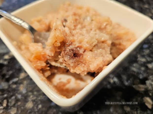 A close up photo of a spoonful of the Instant Pot Rice Pudding.