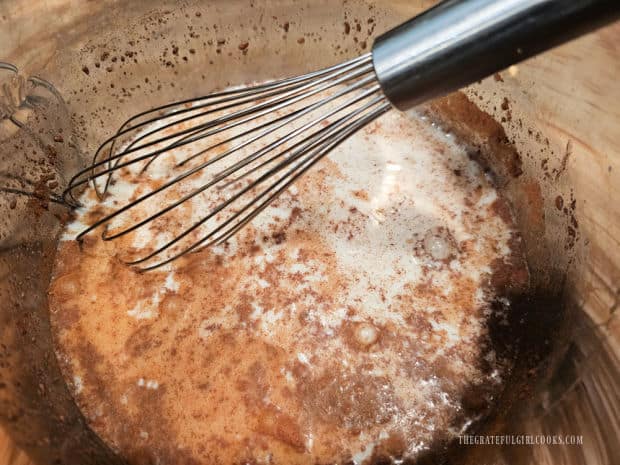 Ingredients for the rice pudding are whisked together before cooking.