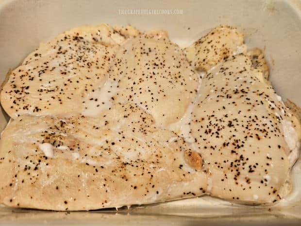 Seasoned chicken breasts are baked 10 minutes, then removed from oven.