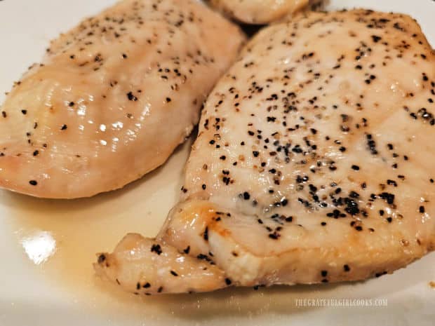 Sauce is spooned over the Maple Glazed Baked Chicken, and then served.