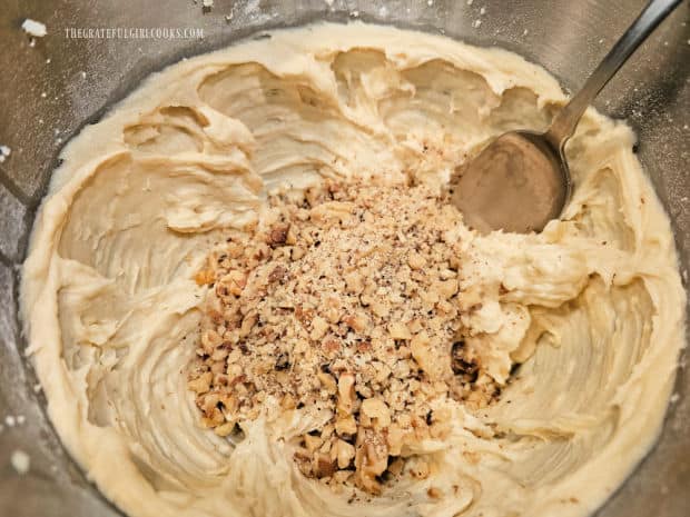 Chopped walnuts are added to the pineapple walnut bread batter.