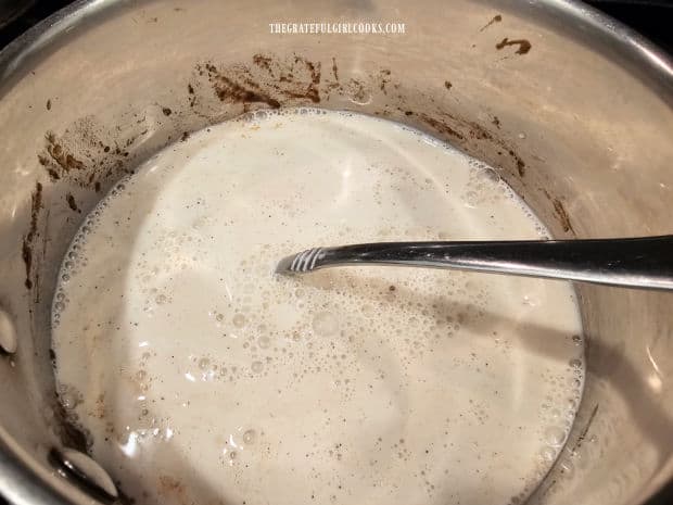 Half and half, milk, and vanilla are blended into the spice mixture in pan.