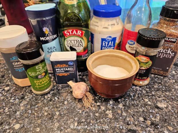 Photo of mayonnaise, oil, vinegar and spices used to make salad dressing.