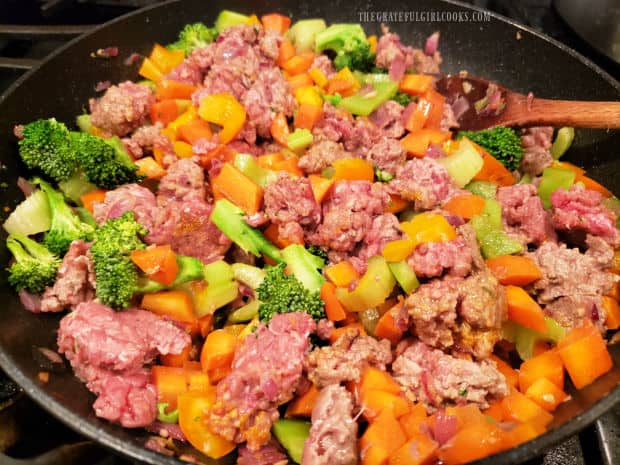 Meat and veggies are cooked until browned, cooked through and tender.