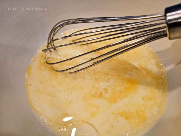 A whisk is used to combine egg, buttermilk and oil.