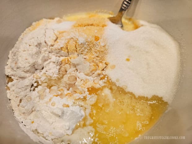 Flour, cornmeal, sugar, baking powder, and salt are added to egg mixture.