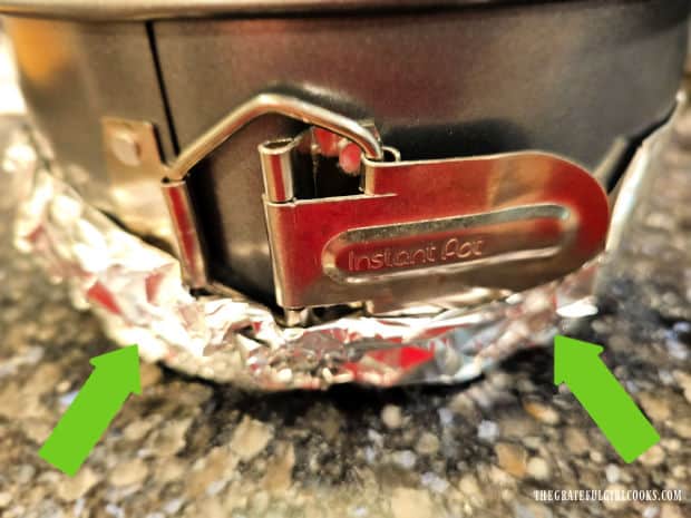 Aluminum foil is tightly wrapped around the bottom of pan, to seal.