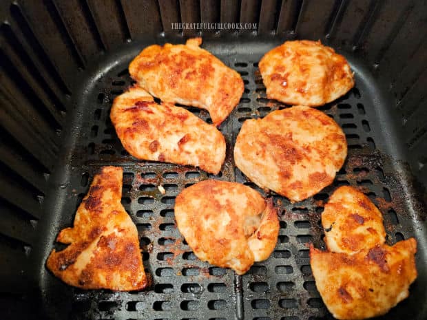 The chicken is flipped over halfway through cooking time.