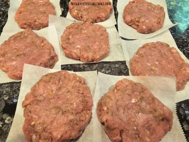 The ground pork sausage patties are flattened into 8 round disks.