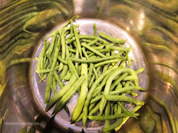 Trimmed green beans in the inner cannister of an Instant Pot.