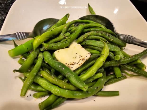 Instant Pot Green Beans, seasoned with salt, pepper, and butter, ready to serve.