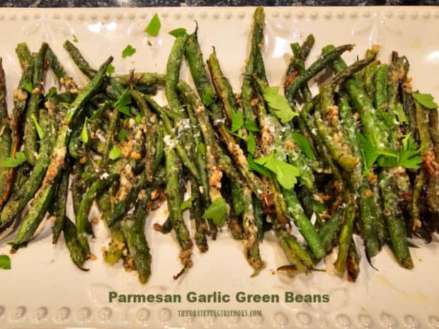 Parmesan Garlic Green Beans are a delicious, easy side dish! They're baked with butter, Parmesan, garlic and Italian seasoning until tender.