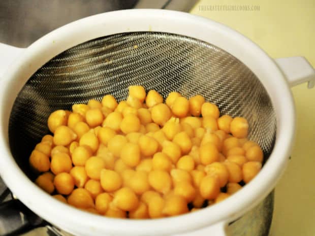 Canned chickpeas (garbanzo beans) are drained and rinsed.