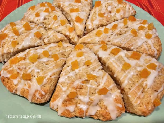 The glazed apricot scones are topped with more dried apricots and served.