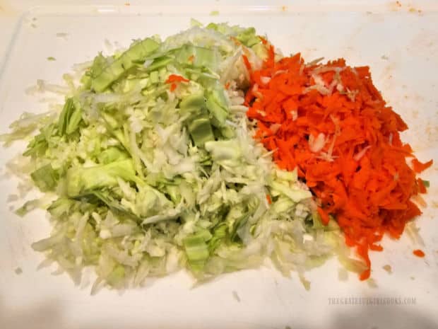 Green cabbage and a medium carrot are grated for the coleslaw.